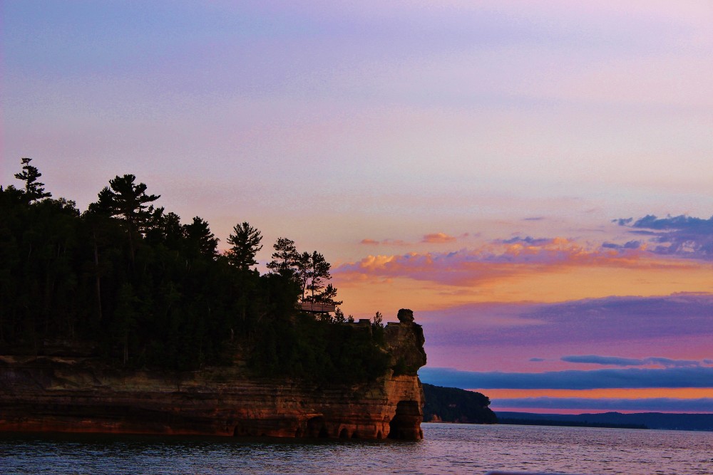 View of Pictured Rocks and sunset from boat tour, Michigan Upper Peninsula
