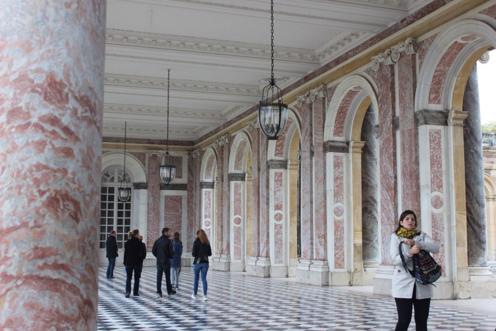 Gorgeous pink and white marble walkway between building at Versailles in France