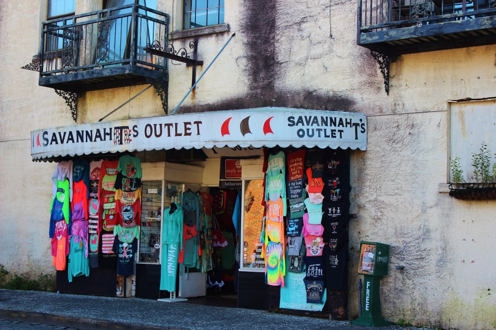 Savannah, GA. Worn looking souvenir shop with t-shirts out front.