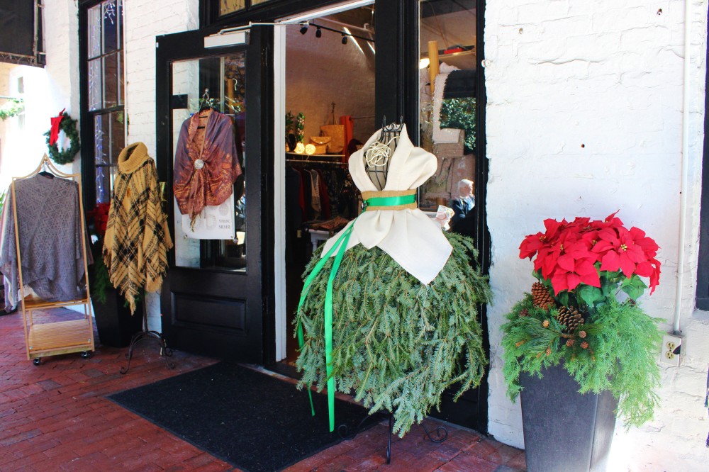 Savannah, GA. Boutique clothing shop with a dress display made from christmas tree branches