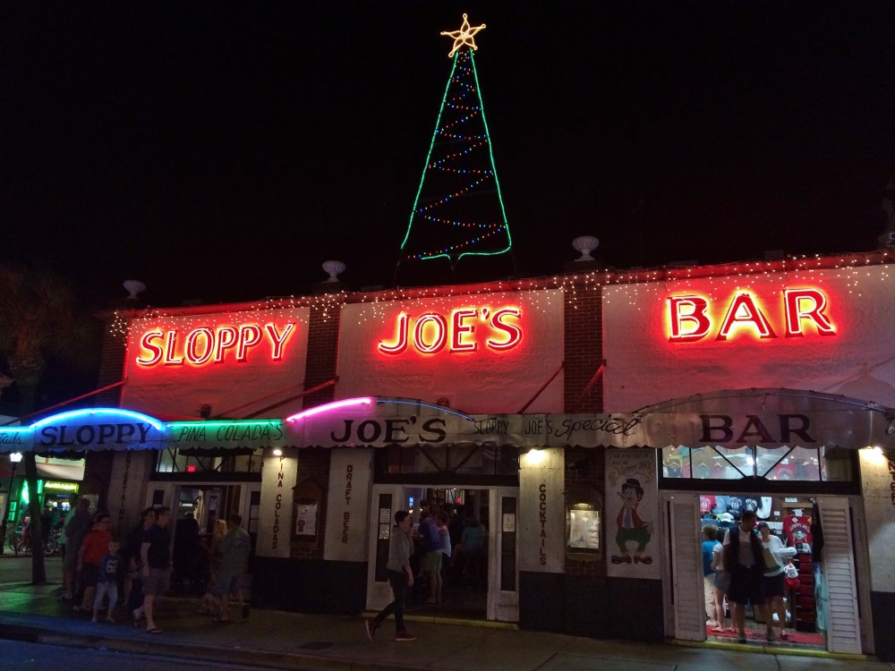 Sloppy Joe's Bar decorated for christmas with a christmas tree light