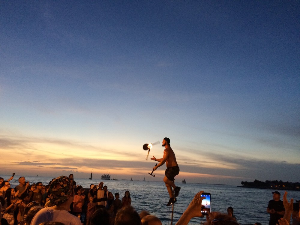juggler on key west pier at sunset