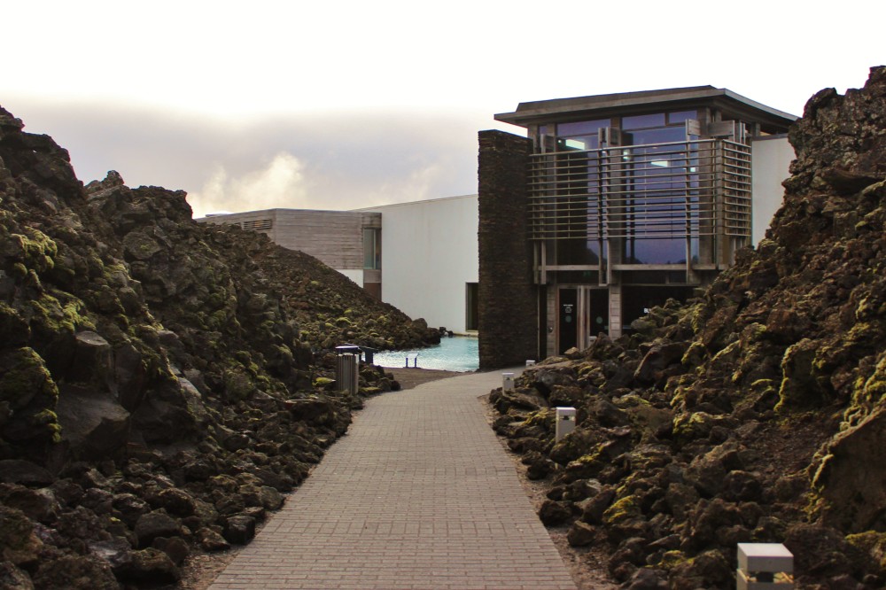 Walkway through lava rocks to the blue lagoon in Iceland