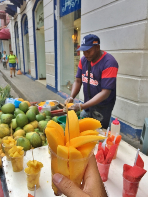 Street vendor selling mangoes